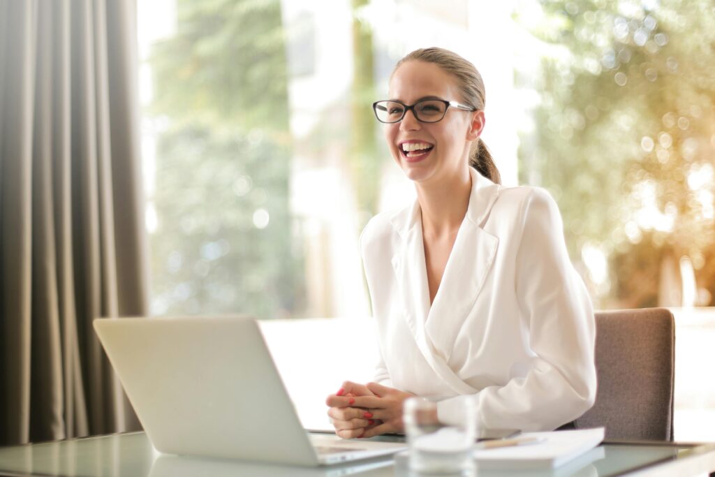 how does a virtual server work? woman smiling on laptop