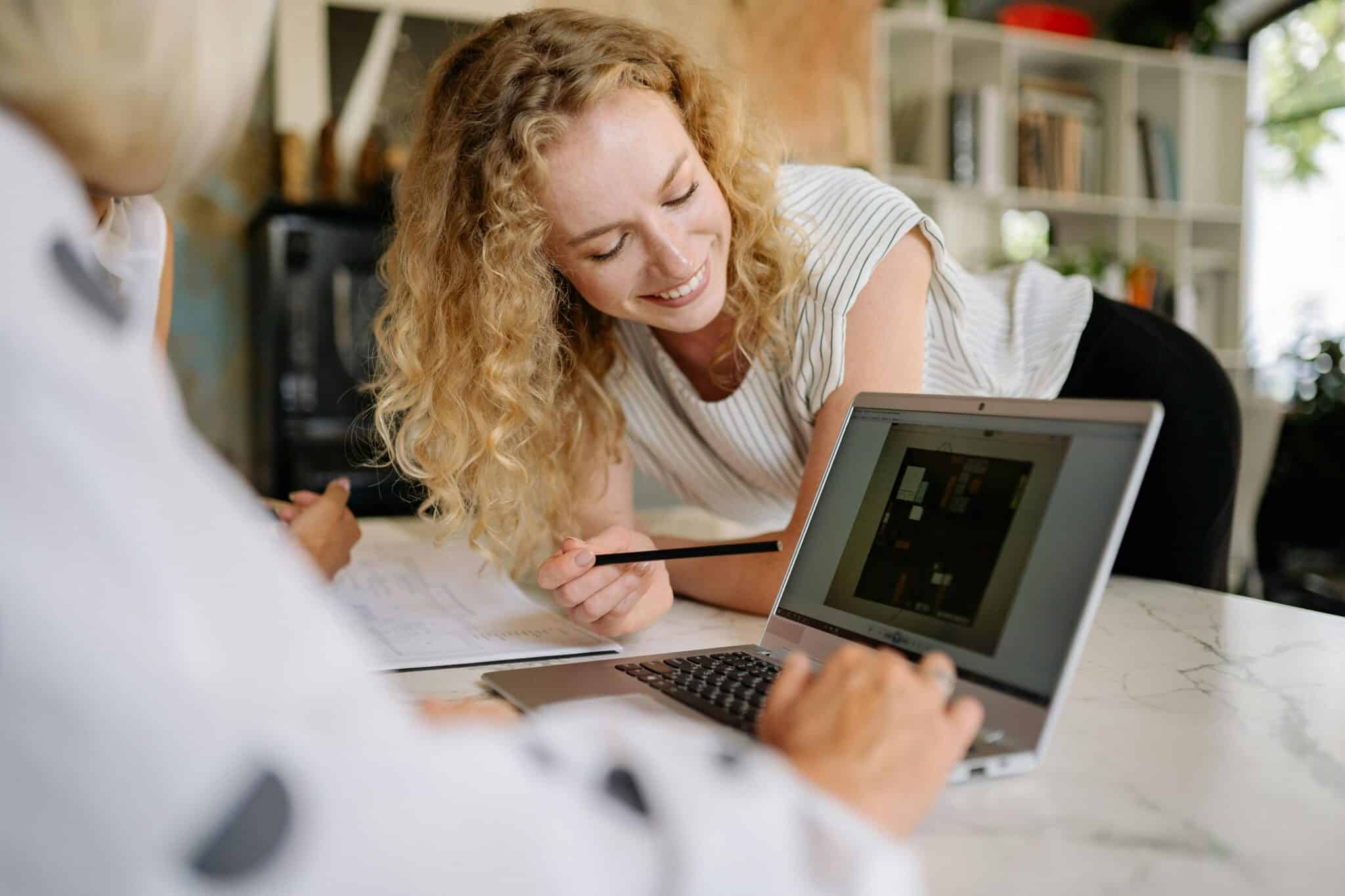 importance of backing up your data - woman smiling at laptop